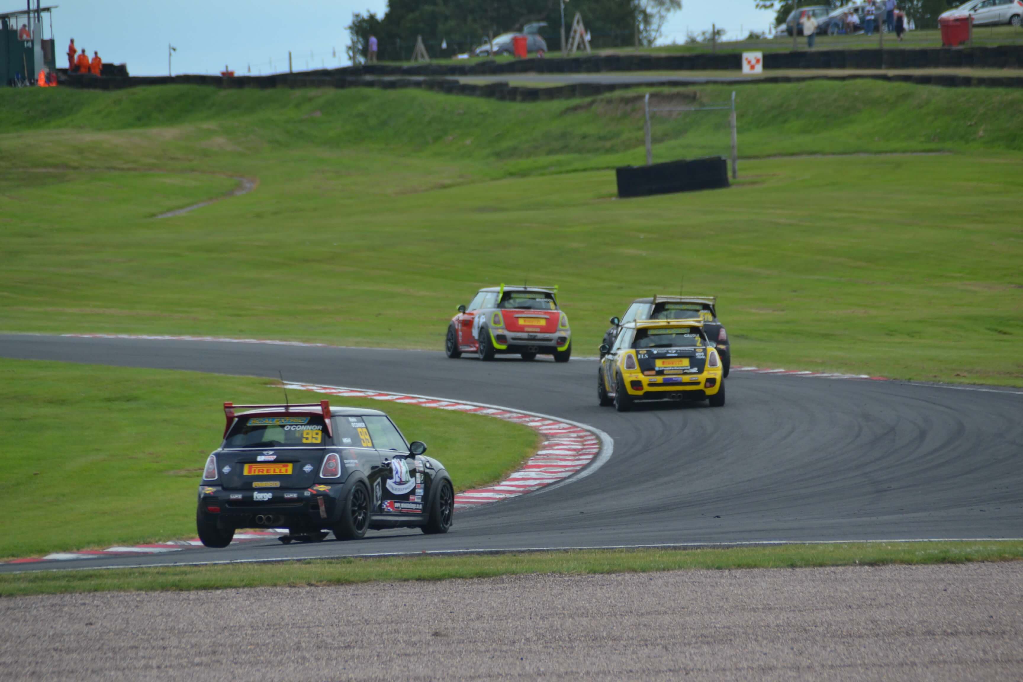 R53 Minis racing around Brands Hatch